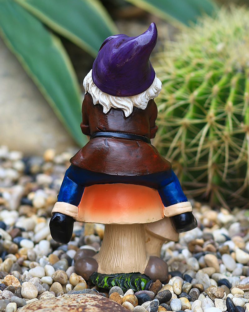 Joyful Gnome Sitting on a Mushroom Garden Statue